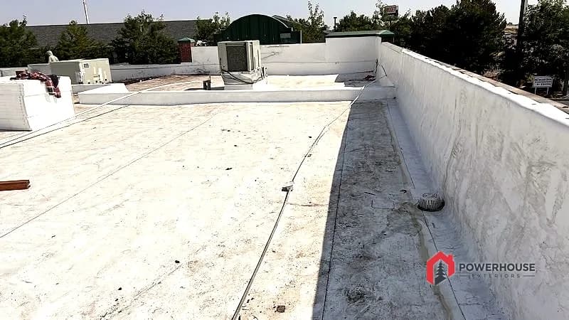 Completed commercial TPO flat roof with finished parapet detailing