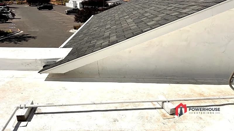 Hotel shingle mansard meeting the completed TPO flat roof