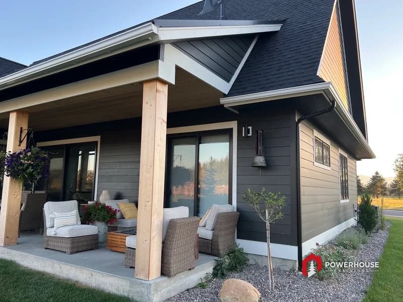 Covered entry with standing-seam metal roof accent and timber columns