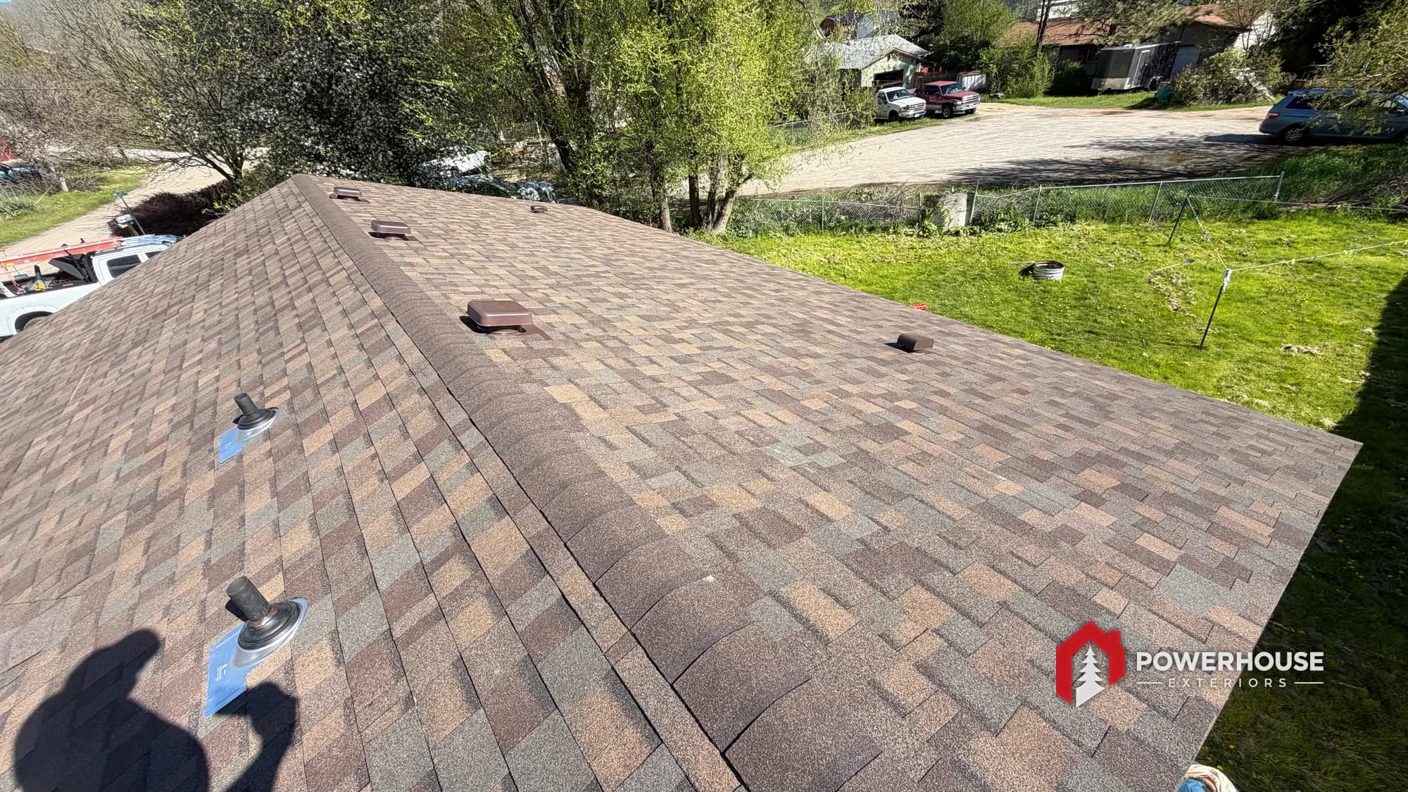 Completed architectural asphalt shingle roof with new box vents in Boise, Idaho