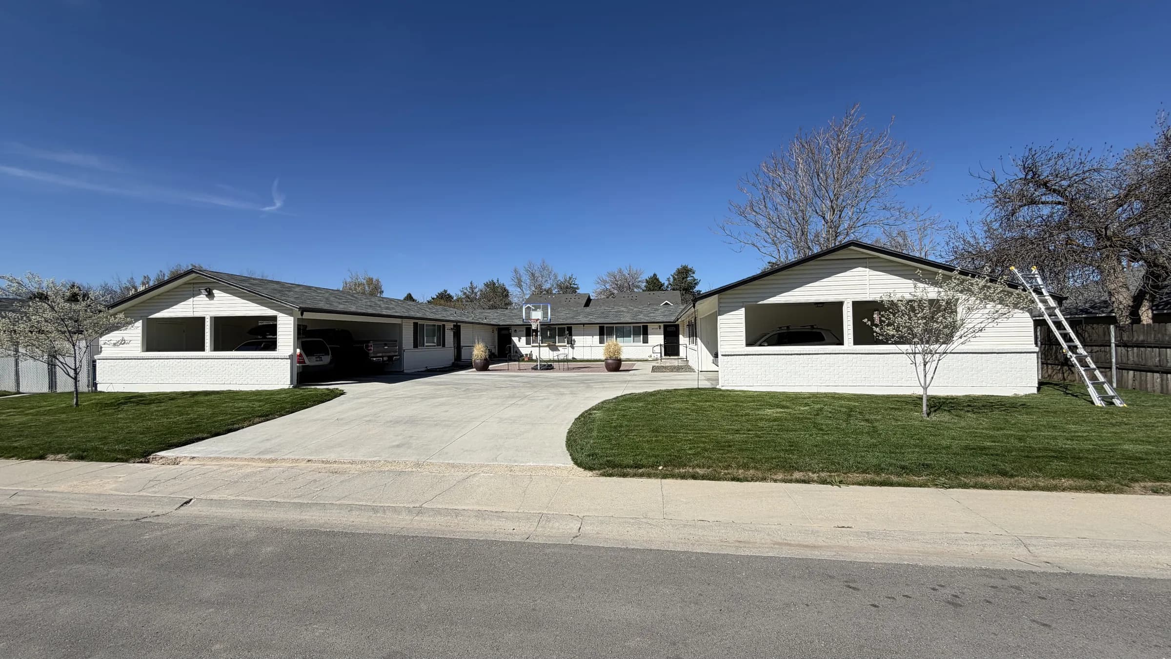 Street view of a Boise multifamily property before roof replacement