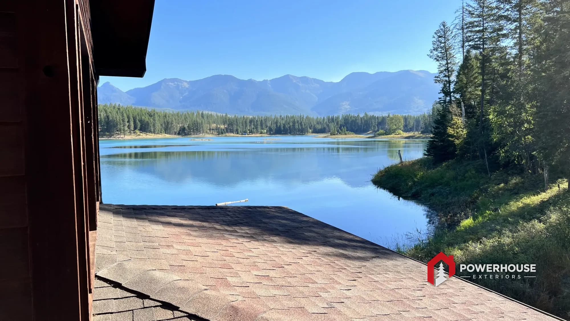 A finished HOA roof overlooking the community lake and mountains