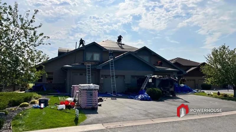 Tear-off and staging underway on an HOA community building