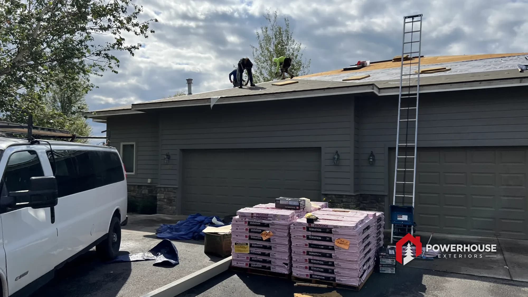 Impact-resistant shingle installation in progress at a Lakeview HOA property in Montana.