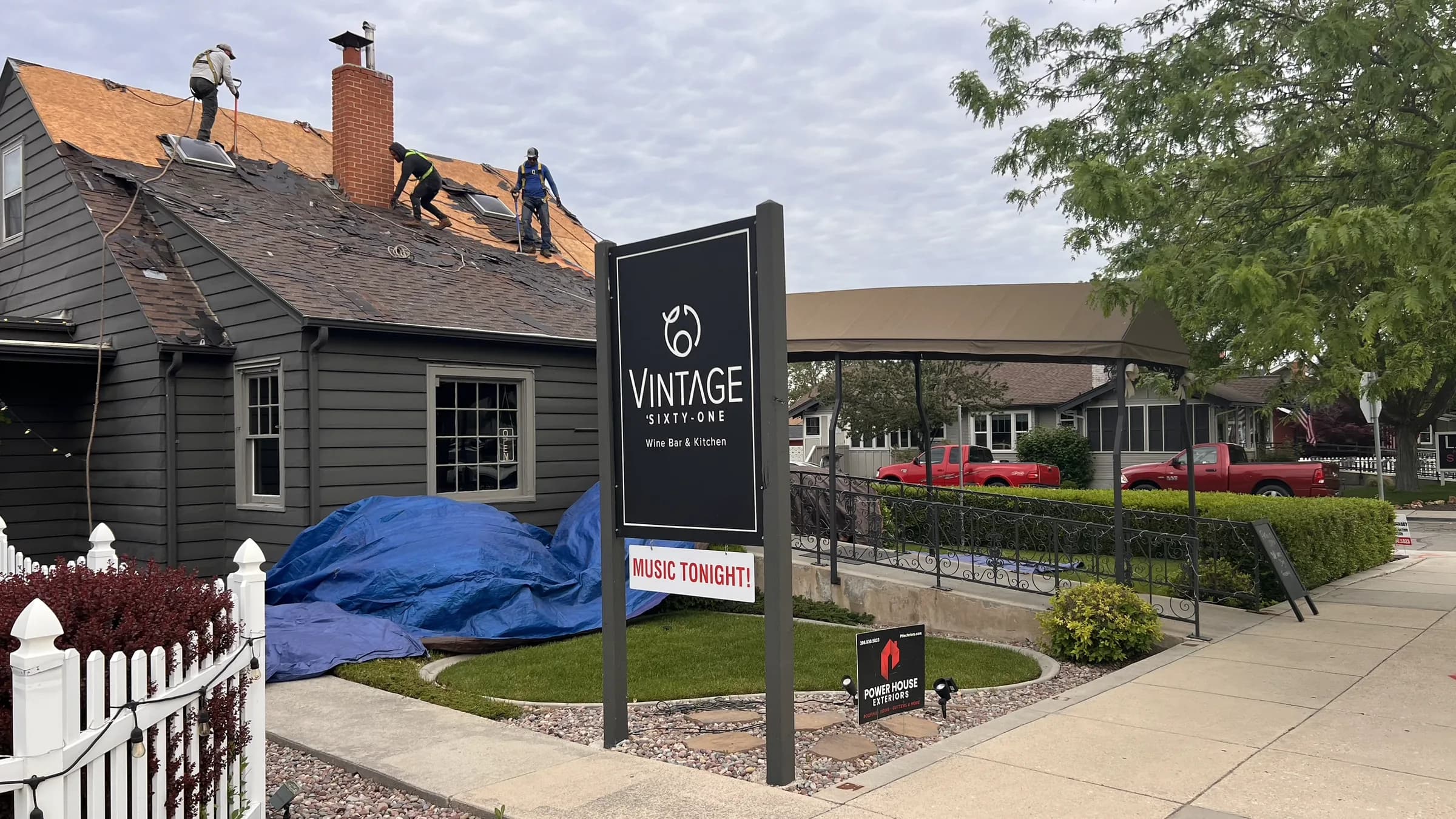 Roofing crew removing old shingles from Vintage 61 Wine Bar & Kitchen in Meridian, Idaho