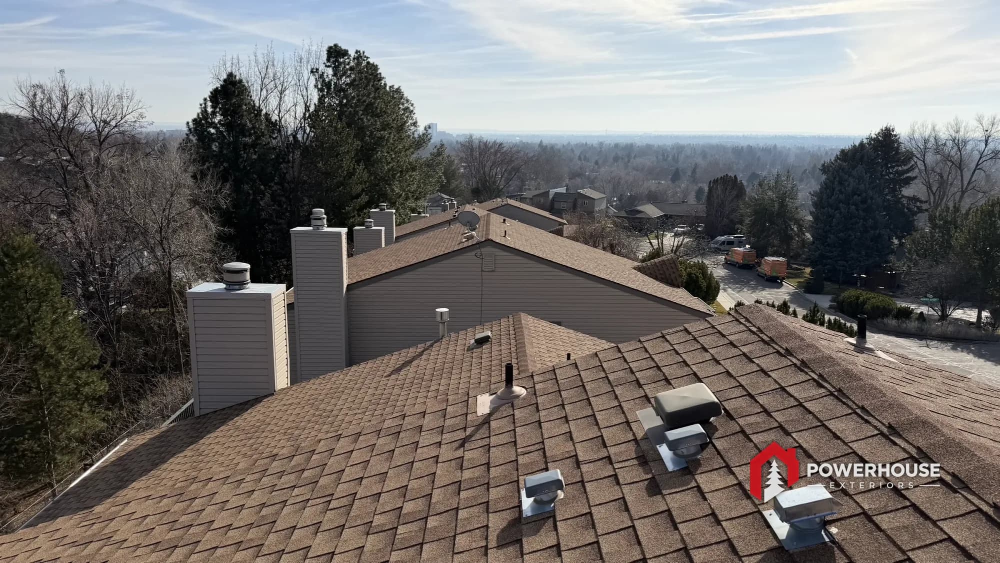 The PowerHouse Exteriors team on a completed roof overlooking the Treasure Valley.