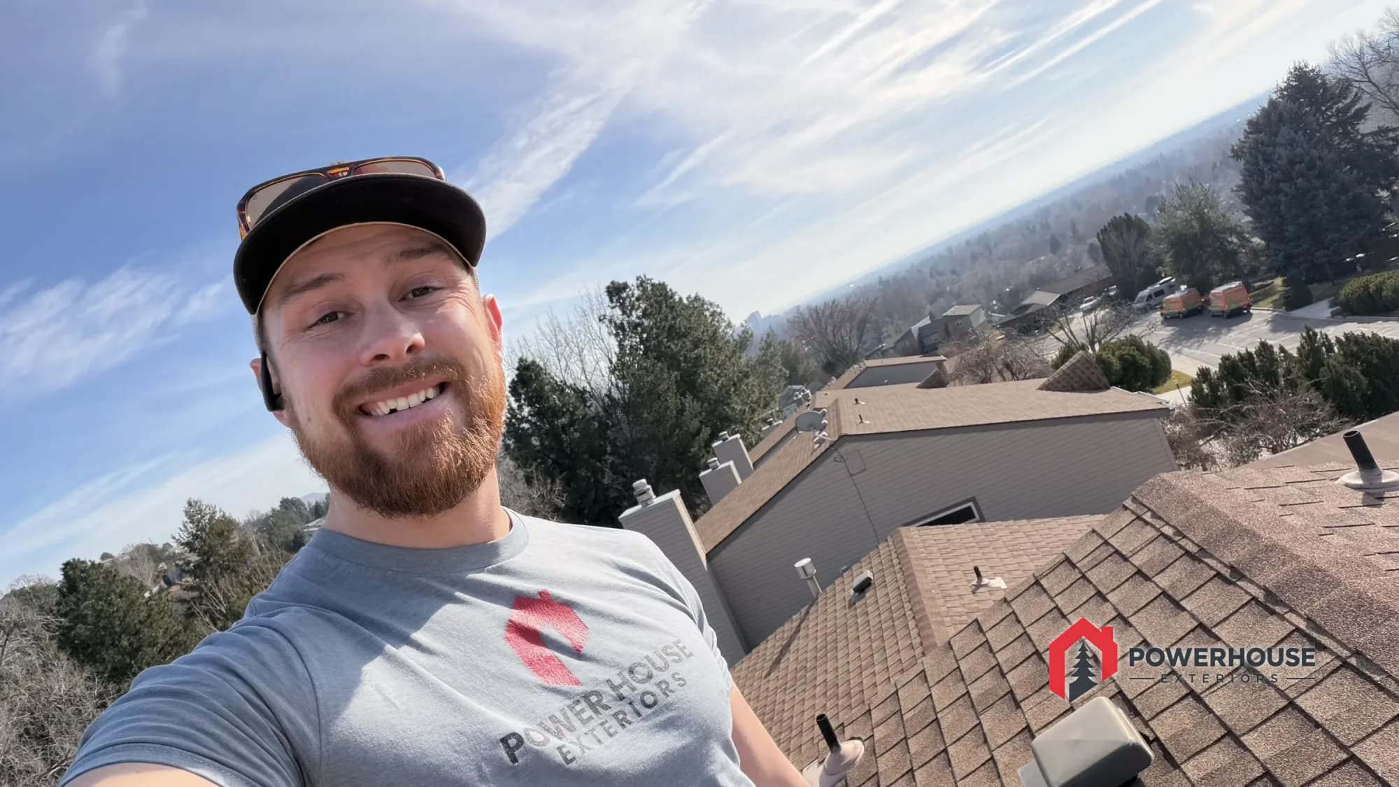 A PowerHouse Exteriors team member on a completed roof overlooking the Treasure Valley.