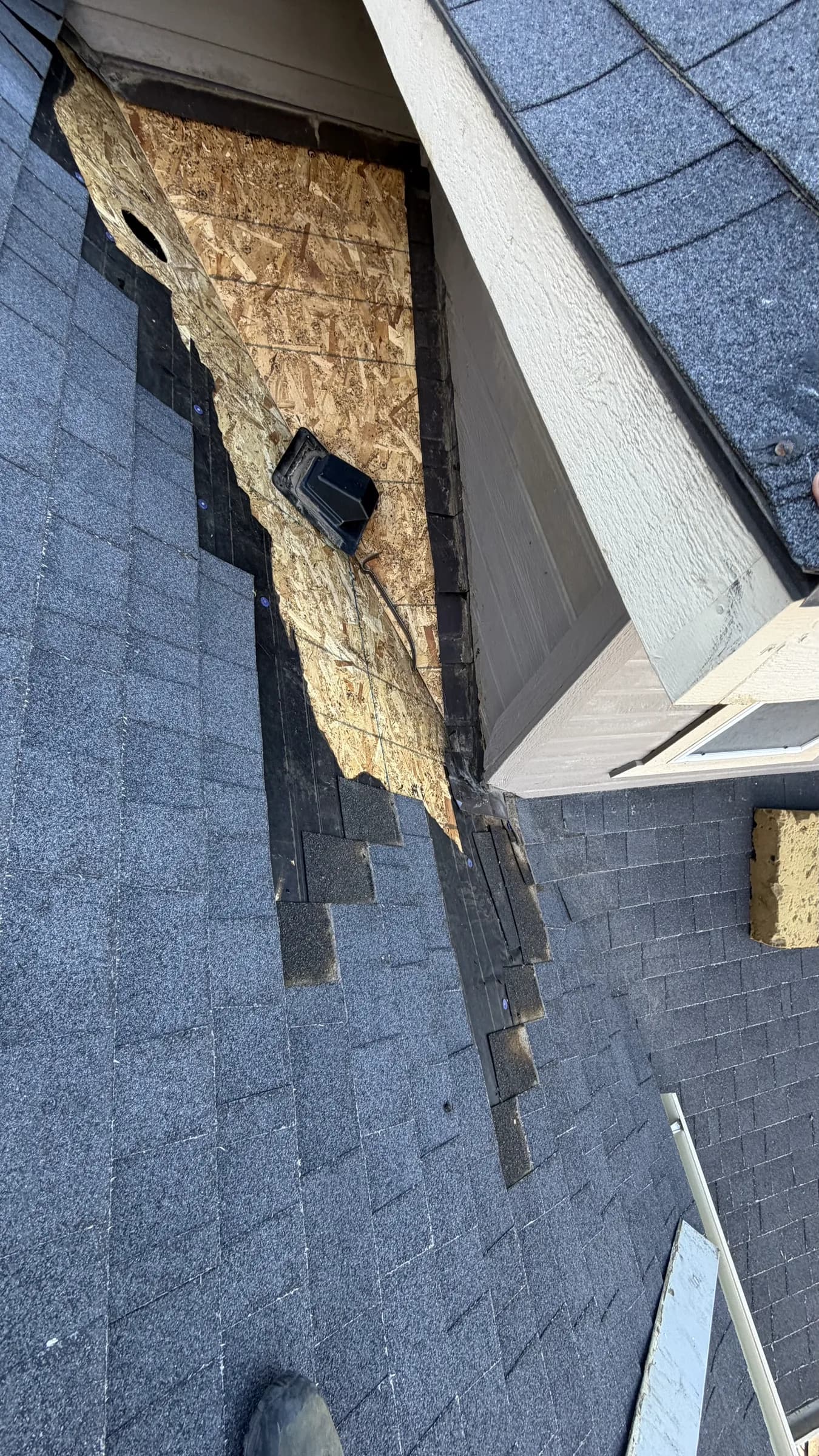 Roof inspector documenting storm-related conditions on a Treasure Valley home